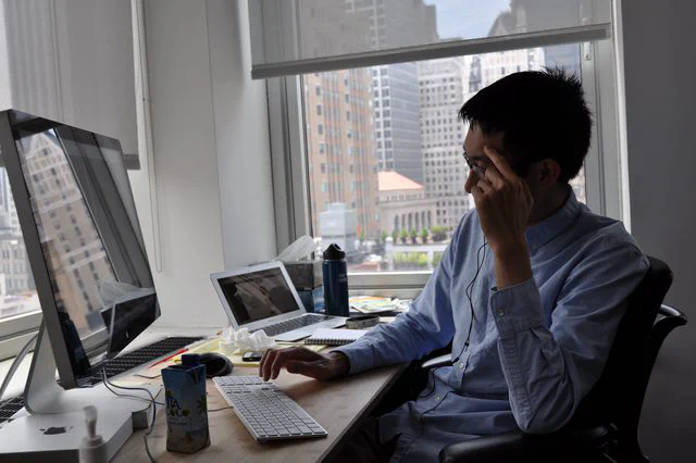 Engineer working at dual monitor setup