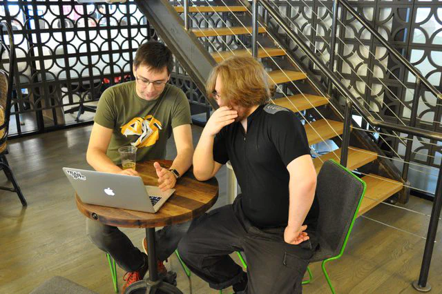 Collaboration space with decorative screen and staircase